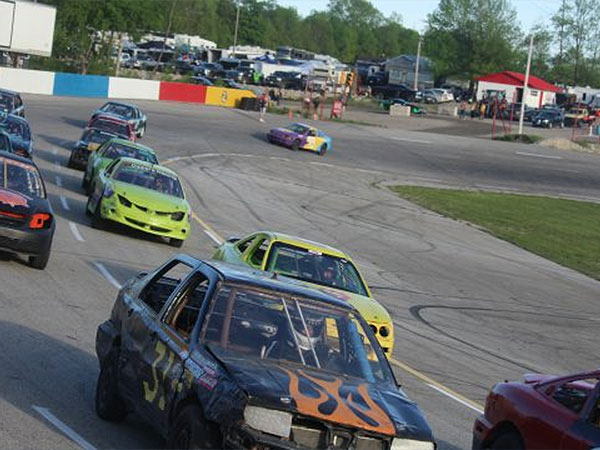 Full Throttle speedway with cars on a track