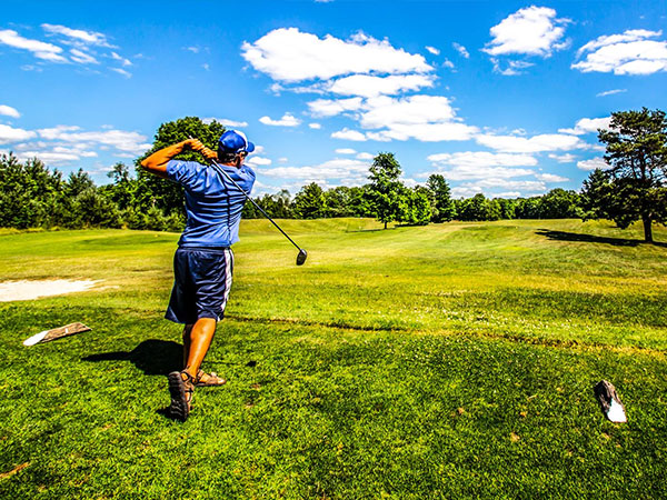 Homestead Golf  course with golfer taking a swing.