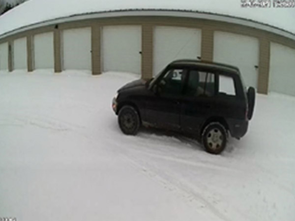 black car at storage units.