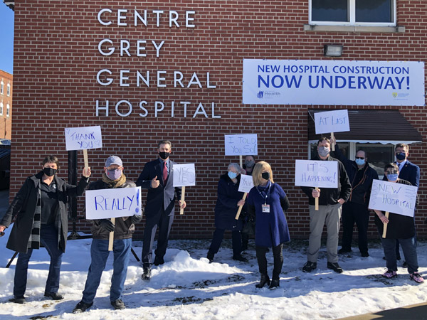 people holding signs at markdale hospital.