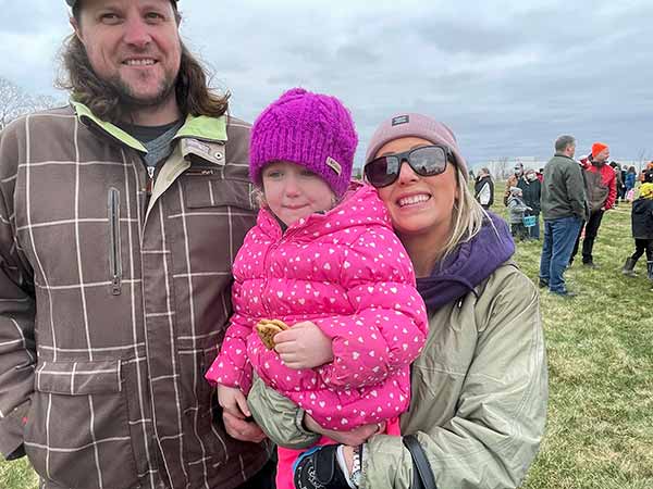 dad, mom and, child after the hunt was over.