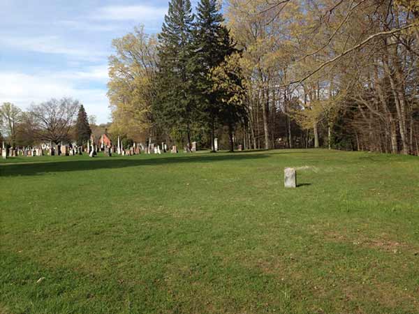 Empty lawn where Potter's Field is located in Greenwood Cemetary