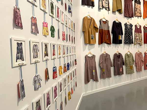 miniature paintings and full size dressed hung in gallery.