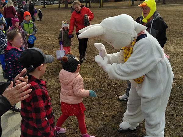 The Easter Bunny greeted kids at the Durham Easter Egg Hunt