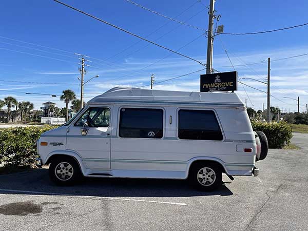 white van parked at roadside