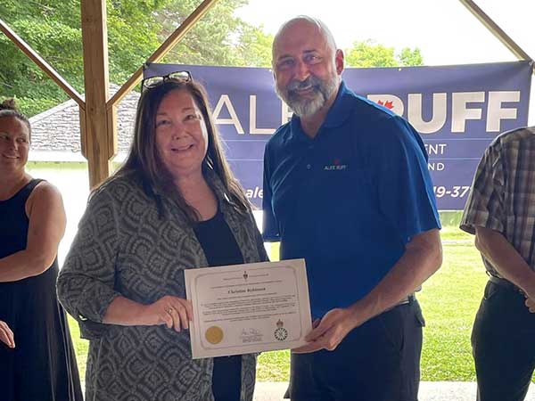 Christine Robinson receives award from MP Alex Ruff