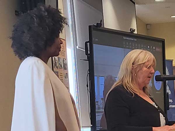 Joan John receives award presented by Janice Kaikkonen