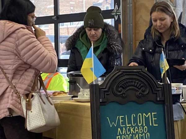 Ukrainian immigrants vending at local market