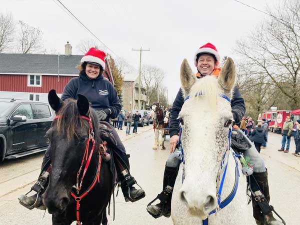 Lori and Wayne Billings ride in the 2024 Holstein Santa Parade.