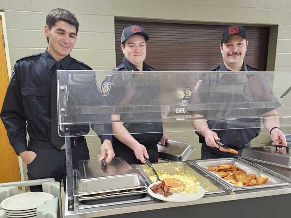 Firefighters take a turn serving breakfast hosted by the Durham Lion's Club