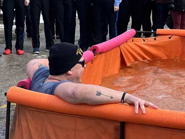 A West Grey Firefighter soaks in the cold water