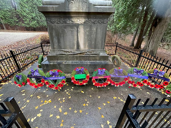 Wreaths laid at the foot of the war memorial.