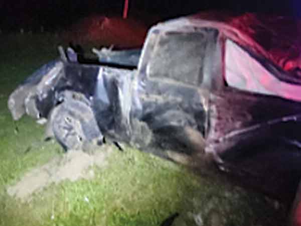 Pickup truck heavily damaged.