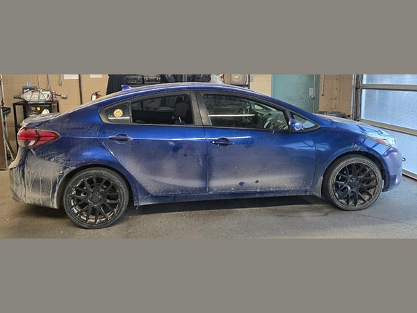 Suspect vehicle, a blue 4-door Kia Forte sedan.